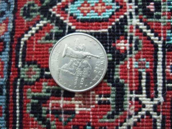 Sideways View of Quarter on Rug to assess KPSI which is Approximately 255