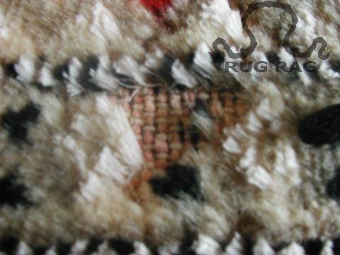 Moth Damage to the Pile of a Jaldar Double knotted rug from Pakistan