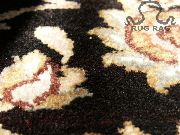 Black Carpet Pile Close-Up under Strong Day Light