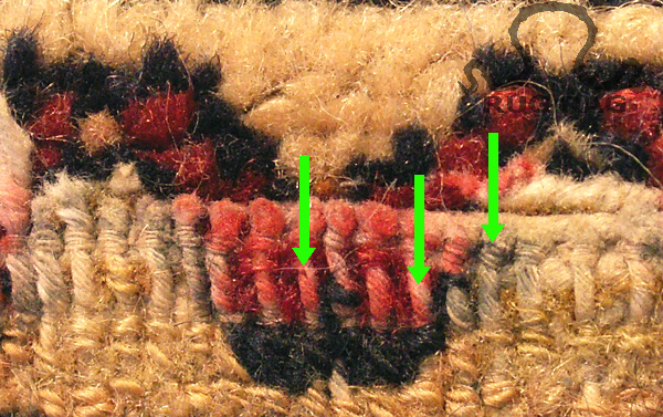 Markered threadbare areas of a Rug