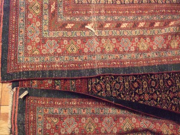 Reverse sides of the rug folded over the face