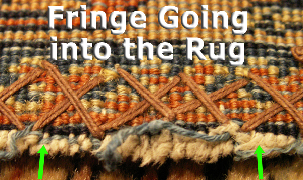 Photograph of the fringe going into the rug