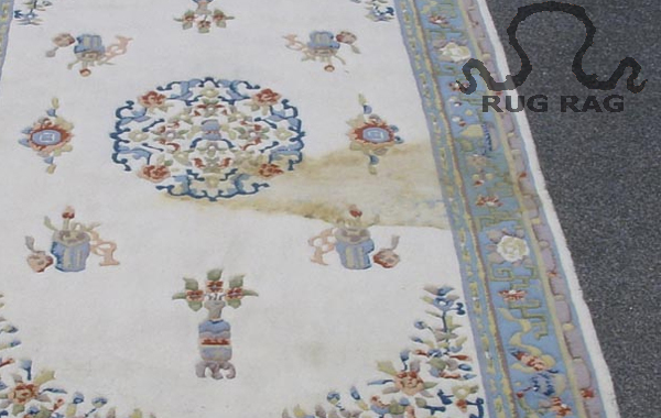 Indian Interpretation of Chinese Art Deco Rug with heavy staining to the pile