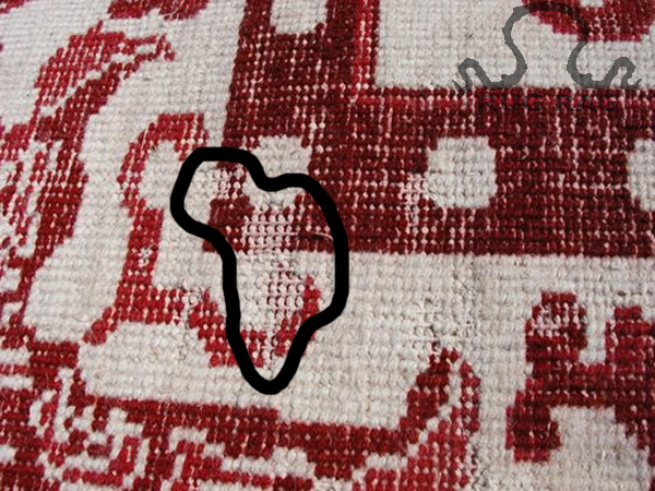Moth damage to the Reverse side of an older Indian Oriental Rug