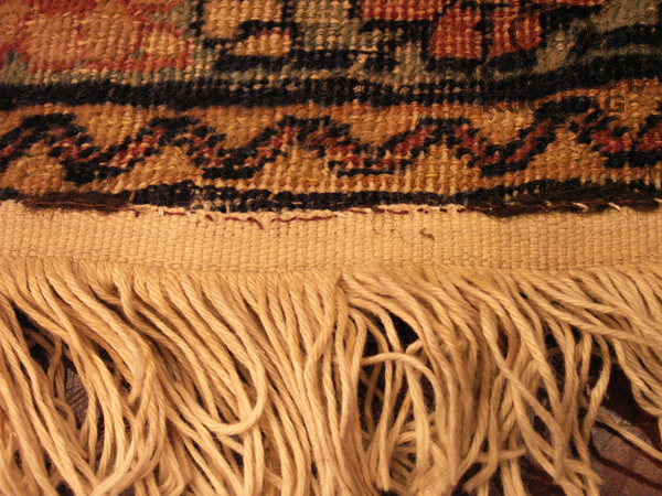 Close up inspection of machine made fringe with hand application