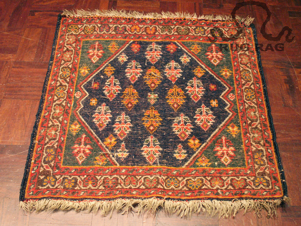 Reverse side of sun faded Afshar Rug