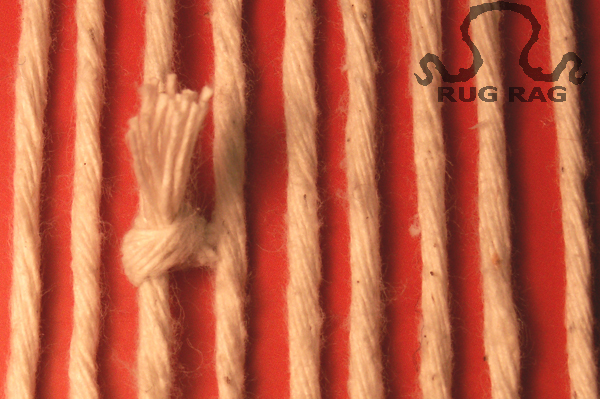 White knots on the warp